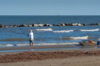 Man fishing on the beach at Grand Isle State Park