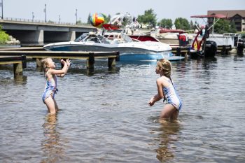 girls playing in lake in Minocqua Wisconsin