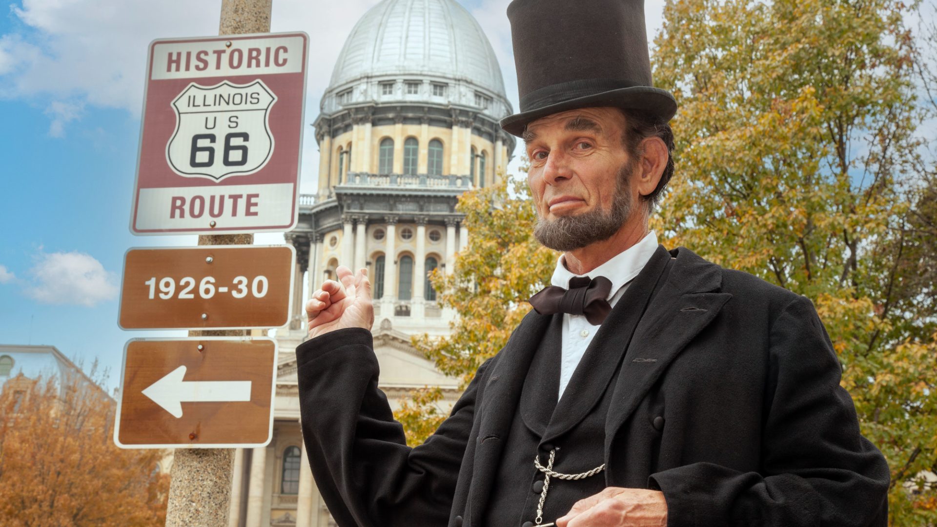 Abe Lincoln actor in front of Route 66 sign in Springfield Illinois