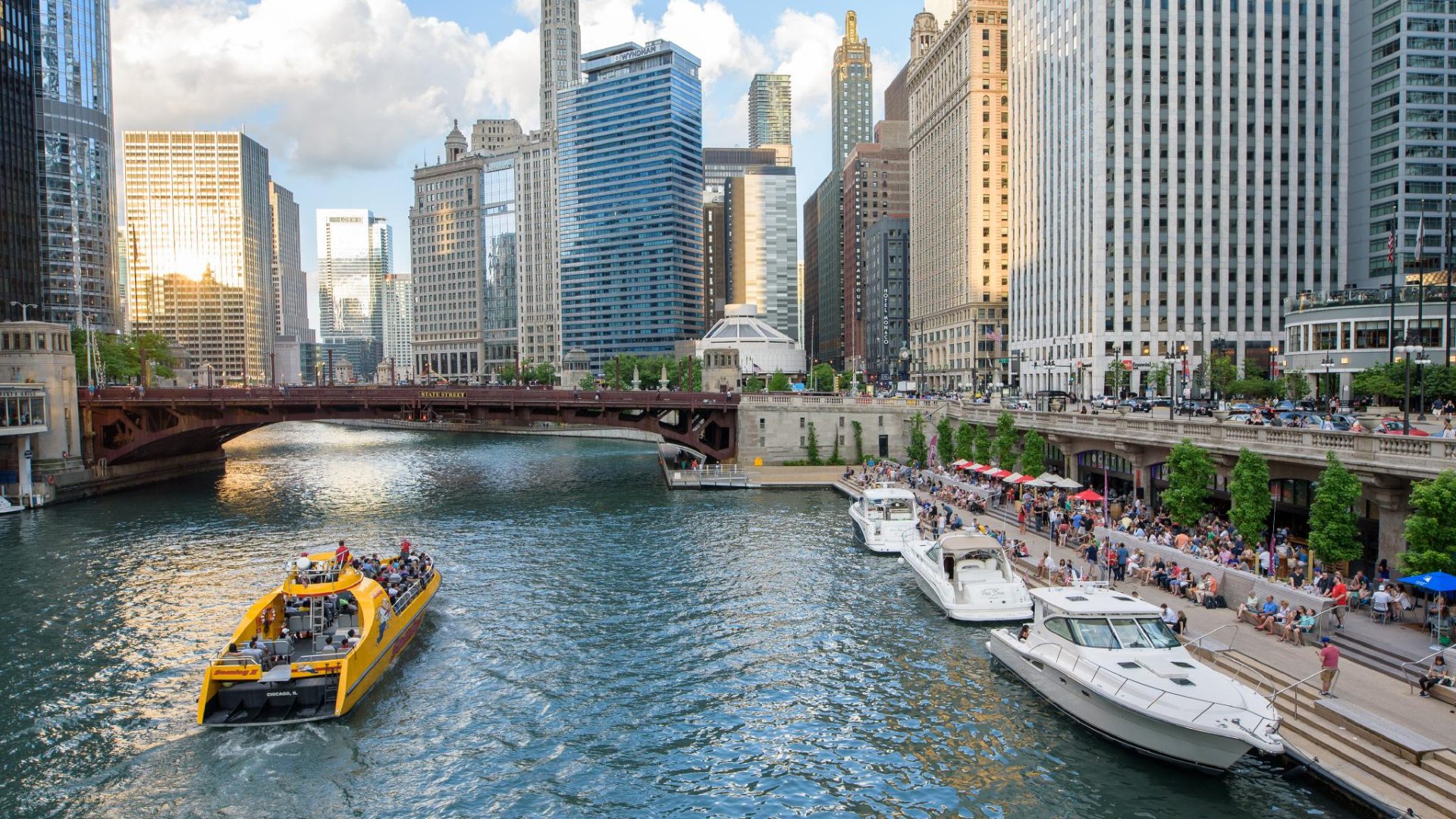 boats on the chicago river in chicago il with skyscrapers in the background