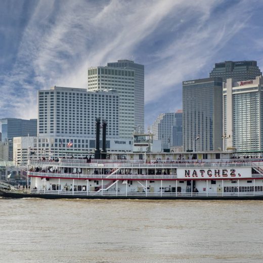 photo of the Steamboat Natchez cruising on the Mississippi River in New Orleans